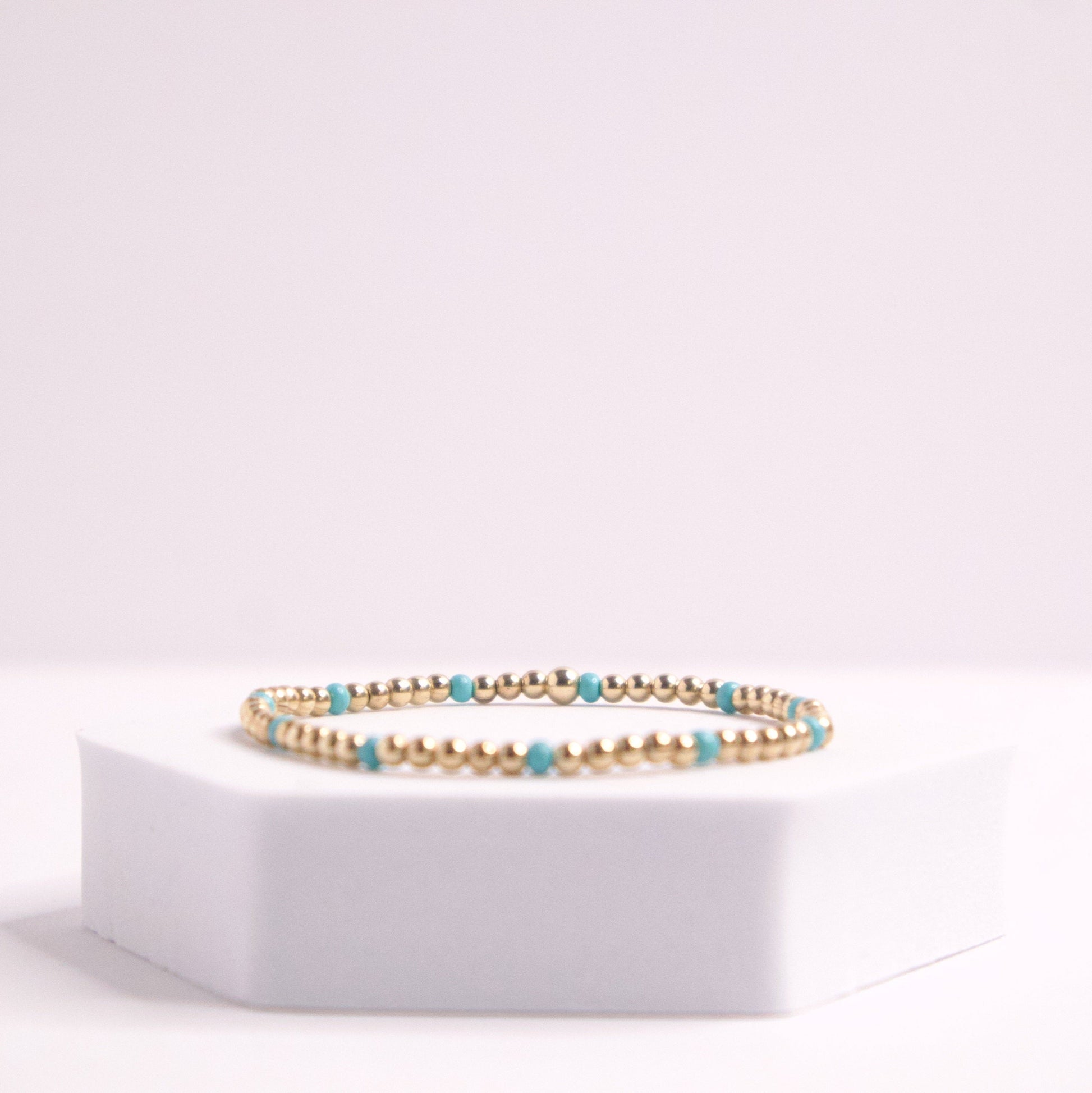 14k gold filled beaded bracelet and blue seed bead bracelet