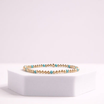 14k gold filled beaded bracelet and blue seed bead bracelet